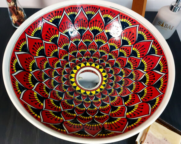 Top-down view of a handmade ceramic basin with a stunning lotus-inspired pattern, blending tradition with elegance.