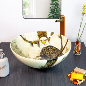 Unique ceramic basin depicting a detailed eagle in a misty forest, adding a bold touch to your space.