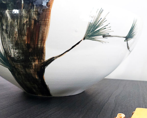 Side perspective of Eagle’s Gaze sink, showing its smooth ceramic finish.