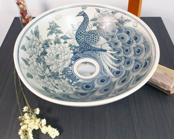 Overhead shot of Elegant Peacock sink, highlighting the intricate bird design.