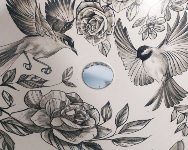 Close-up of Floral Serenity ceramic sink, revealing the intricate hand-drawn flowers.