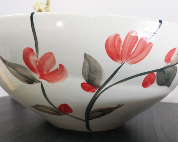 Side view of Furry Friend sink, showing its smooth and glossy ceramic finish.
