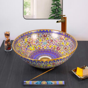 Exquisite ceramic sink with delicate golden floral patterns and royal blue accents.