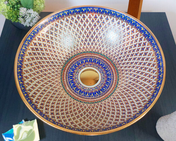 Overhead shot of Ivory Lotus sink, displaying its symmetrical floral-inspired design.