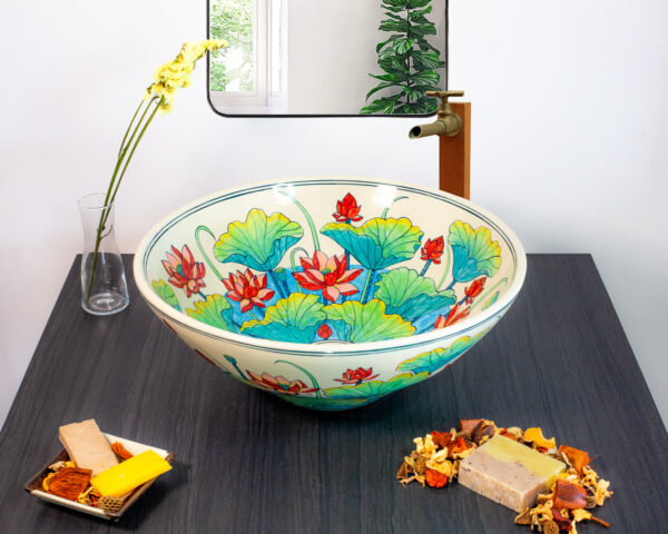 Tranquil ceramic sink inspired by the Thai lotus flower, featuring soft blue and coral hues.