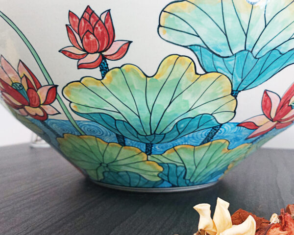 Side profile of Lotus Harmony ceramic sink, displaying its graceful shape.