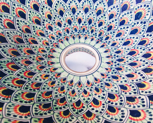 Close-up of Majestic Plume sink, highlighting the fine details of its feather motifs.