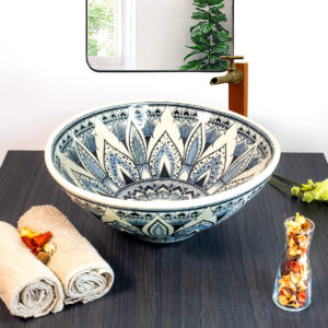 Artistic ceramic sink with intricate blue mandala patterns, symbolizing balance and Thai heritage.