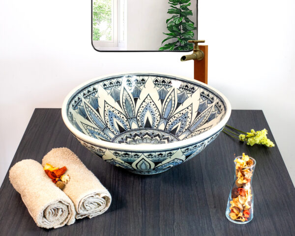 Artistic ceramic sink with intricate blue mandala patterns, symbolizing balance and Thai heritage.