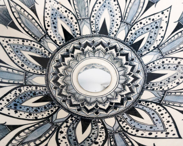Close-up of Mandala Bloom sink, revealing its delicate symmetrical details.