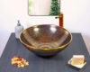 Sophisticated black and gold ceramic sink with a mesmerizing symmetrical pattern.
