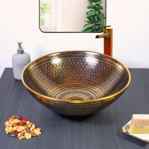 Sophisticated black and gold ceramic sink with a mesmerizing symmetrical pattern.