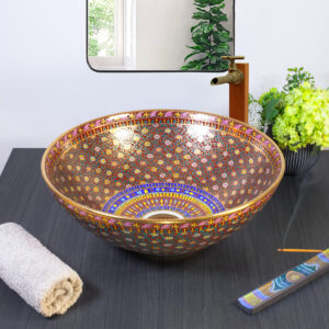 Elegant ceramic sink featuring rich red and gold geometric patterns for a regal look.