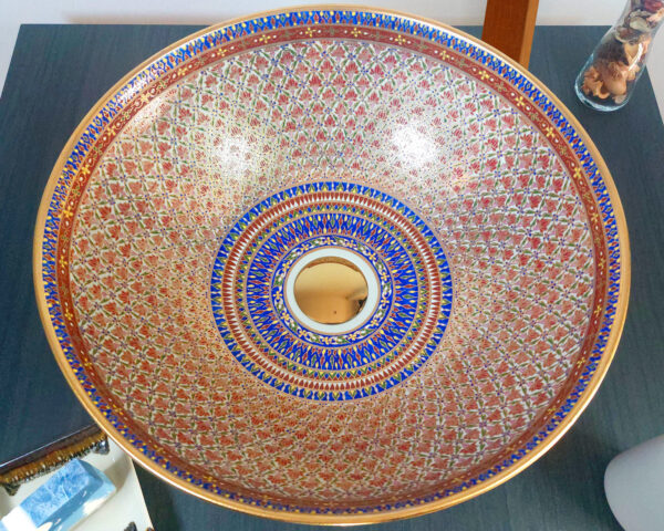 Overhead view of Ruby Star sink, showcasing its elaborate hand-painted symmetry.
