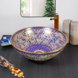 Luxurious Benjarong-style ceramic sink with deep blue floral patterns and gold accents.