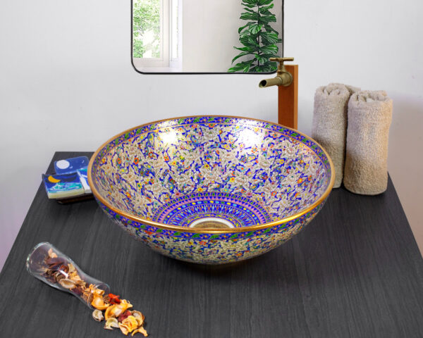 Luxurious Benjarong-style ceramic sink with deep blue floral patterns and gold accents.