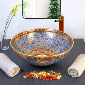 Classic Thai ceramic sink with an intricate blue floral pattern and golden borders.