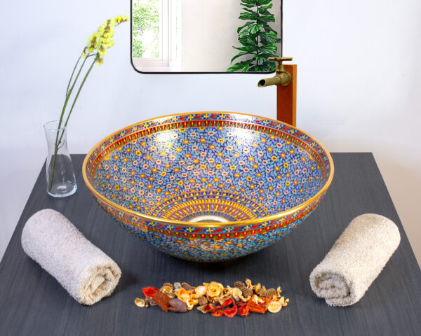 Classic Thai ceramic sink with an intricate blue floral pattern and golden borders.