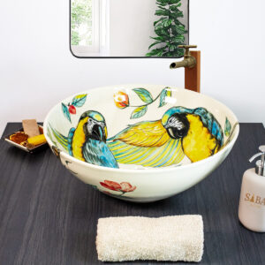Lush tropical-themed ceramic sink with colorful parrots and foliage, perfect for nature lovers.