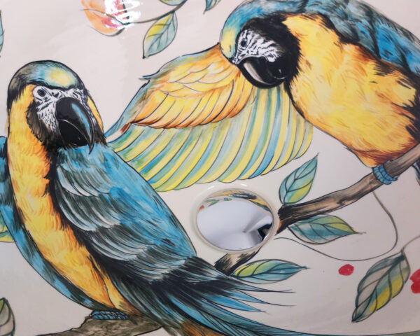 Close-up of Tropical Parrots sink, showcasing the vibrant feathers and leaves.