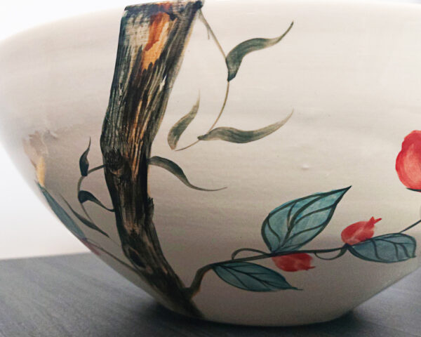 Side view of Tropical Parrots sink, revealing its smooth ceramic finish.