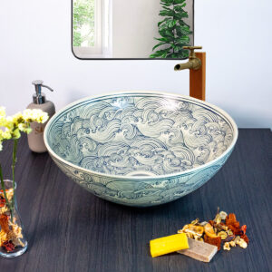 Elegant ceramic basin featuring soft swirling patterns reminiscent of flowing water for a serene bathroom ambiance.