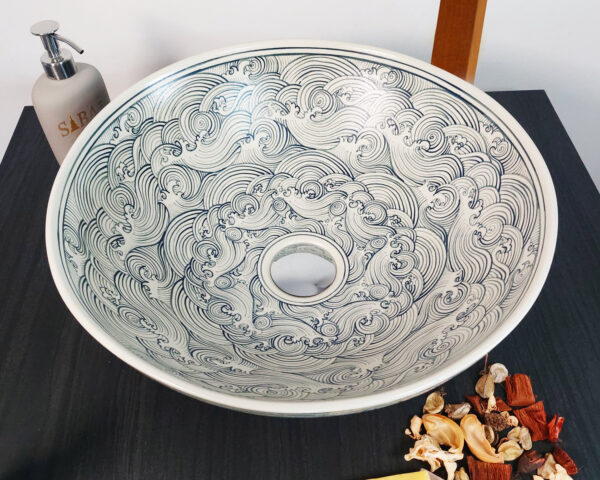 Top-down view of the Zen Breeze ceramic sink with intricate wave-like patterns.