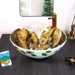 Front view of Elephant Embrace sink featuring two facing elephants.