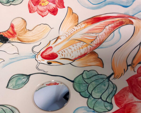 Close-up of koi fish and water lily detail.