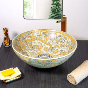 Front look at ceramic sink with golden vine pattern