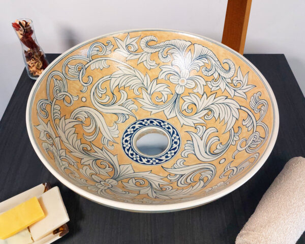 Overhead view of swirling vine design in gold tones