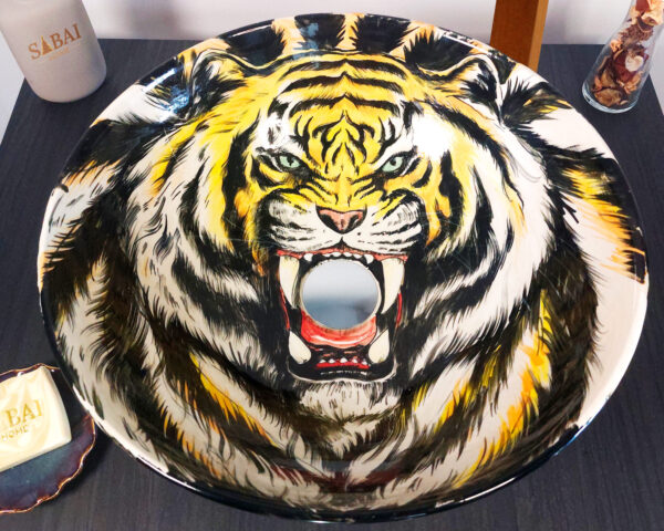 Top view showing detailed tiger illustration surrounded by foliage.