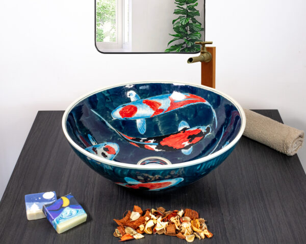 Front view of koi fish ceramic basin with blue water motif