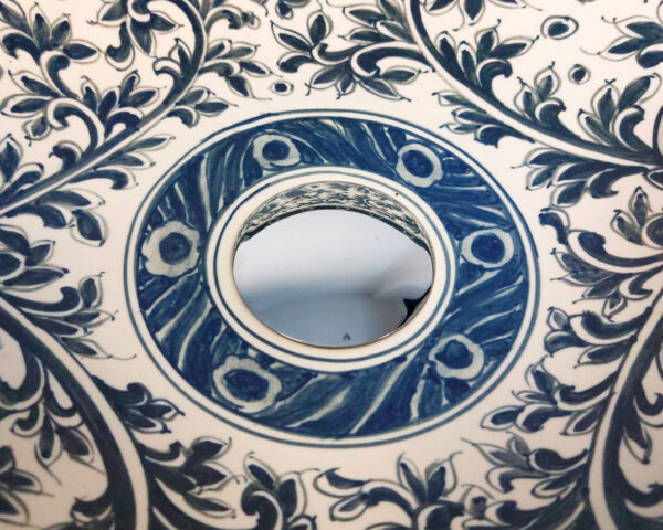 Close-up of intricate blue floral design inside sink