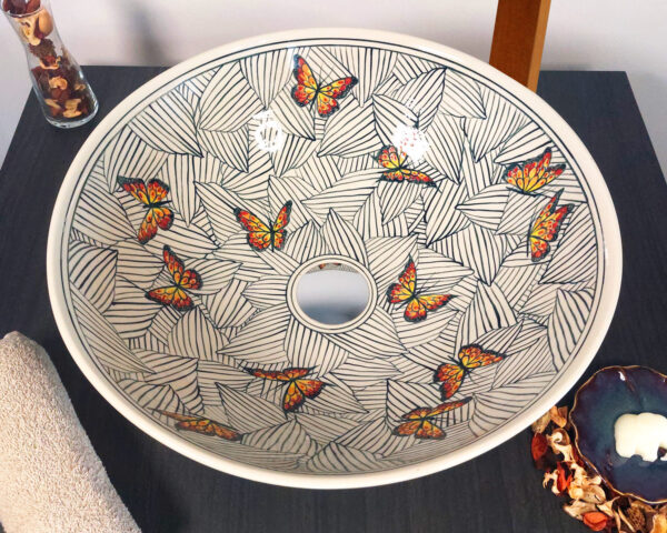 Overhead shot of the Monarch Canopy sink showing detailed butterfly and leaf patterns.