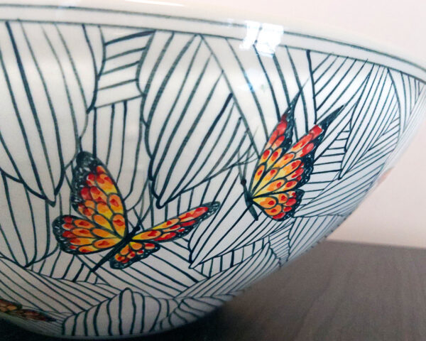 Side profile view highlighting the curved shape and design of the Monarch Canopy sink.