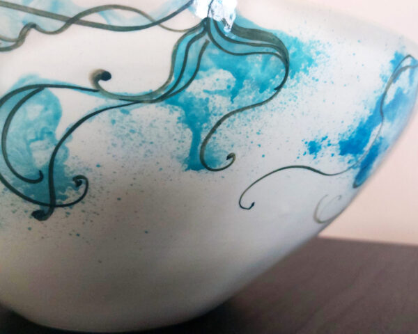 Side profile showing gentle shape and marine patterns.