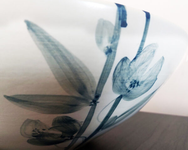 Side profile of the basin showing orchid patterns and contours.