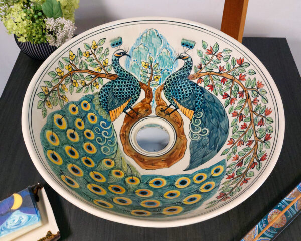 Top view of ceramic bowl with peacock motif