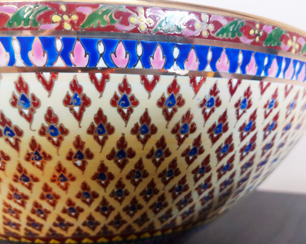 Side view highlighting bowl shape and regal gold-blue design.