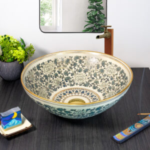 Front view of dark floral ceramic sink with 12% gold paint and rim