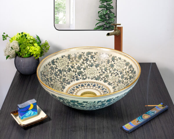 Front view of dark floral ceramic sink with 12% gold paint and rim