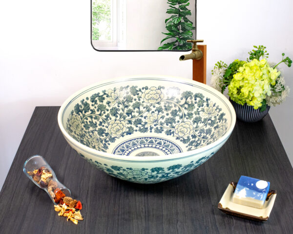 Front view of teal floral ceramic sink