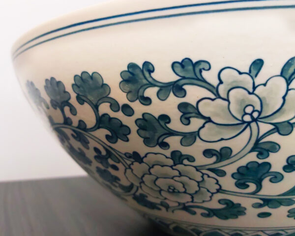 Side angle of botanical teal ceramic basin