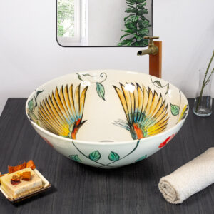 Ceramic sink with vibrant birds in flight from front angle