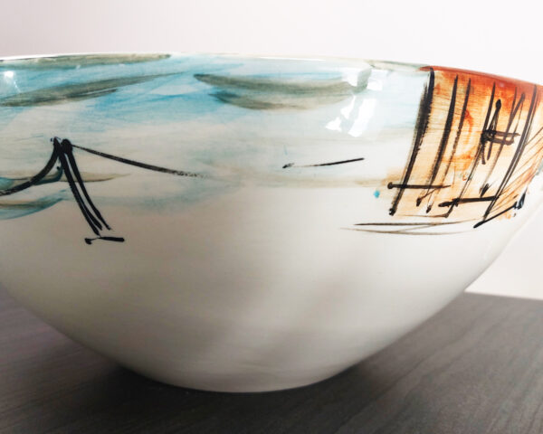 Side profile of Thai Royal Boats handmade ceramic basin, highlighting painted river scene and craftsmanship.