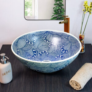 Hand painted Tidal Flow ceramic basin, front view of handmade Thai porcelain sink with wave-inspired design.
